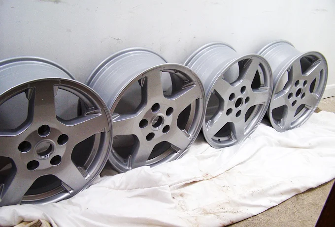 Four alloy wheels refurbished in a fresh metallic finish